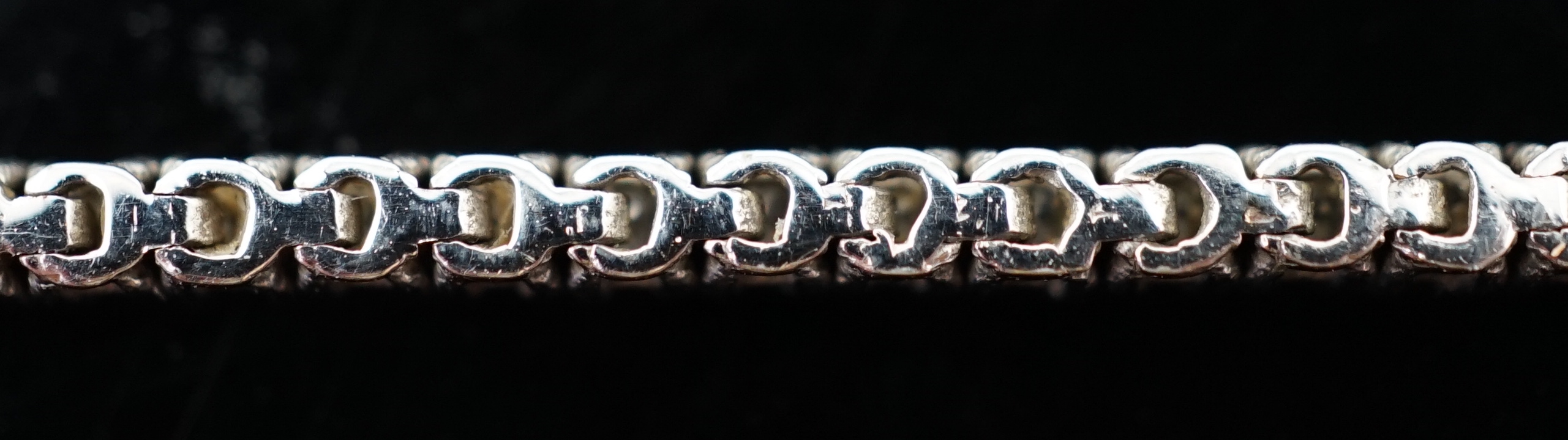 A modern 18ct white gold and diamond set line bracelet